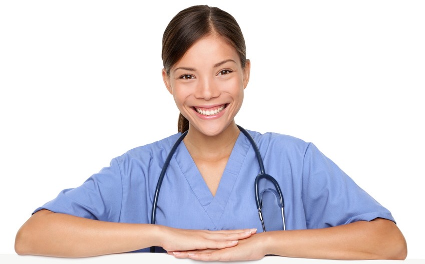Smiling Home Health Solutions Group nurse in scrubs